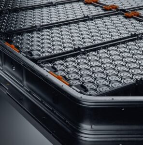 stock-photo-close-up-of-ev-battery-pack-with-orange-connectors-isolated-on-black-background-high-capacity-2365381003-min